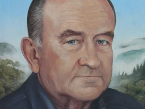Oil painting with a closely framed portrait of an older bald man in a dark jacket and shirt