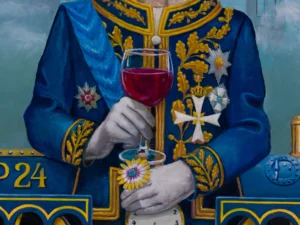 holding a glass of red wine