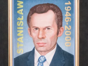 Artwork with framed frontal portrait of a suited man in blue